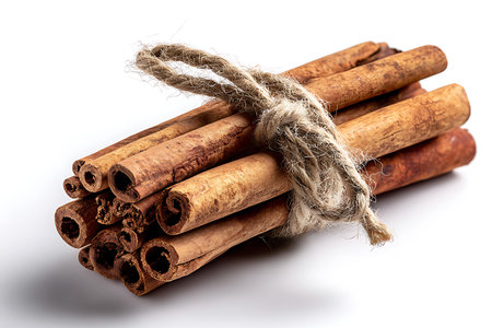 Cinnamon sticks tied with rope isolated on white background. Top view.の写真素材