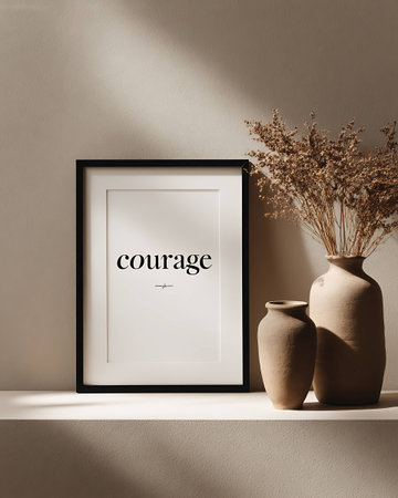 Black frame mockup with dried flowers in vase on white shelf.の写真素材