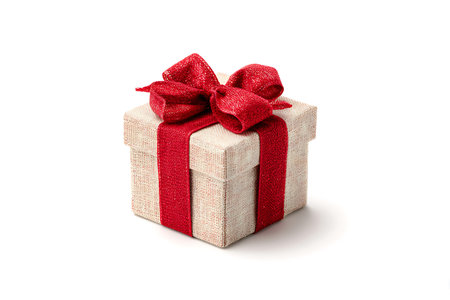 Gift box with red ribbon isolated on white background. Clipping path included.の写真素材