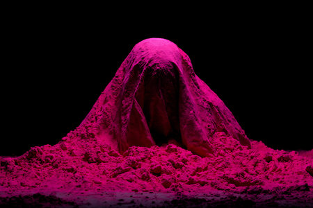 Volcanic crater in magenta color on a black background.の写真素材