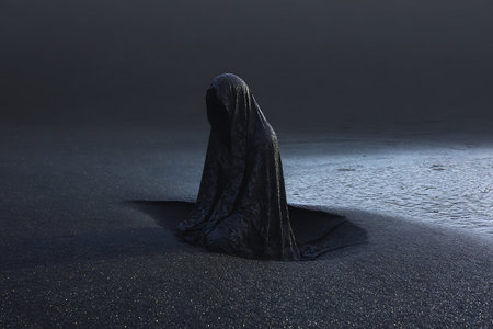 Foggy landscape with a black hood on a black sand beachの写真素材