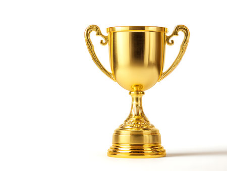 Golden trophy cup isolated on white background. 3d render. Image with clipping pathの写真素材