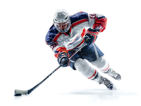 Ice hockey player in action isolated on white background. Studio shot.の写真素材