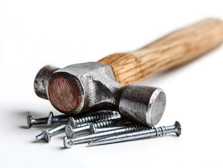 Hammer and nails on a white background. Construction tools. Hammer and nails.の写真素材