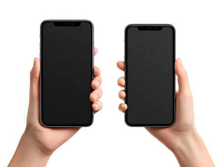 Two hands holding black smartphone with blank screen isolated on white background.の写真素材