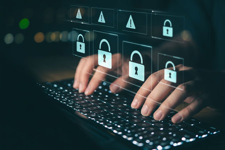 Close up of businessman using laptop computer with padlock icon on screenの写真素材