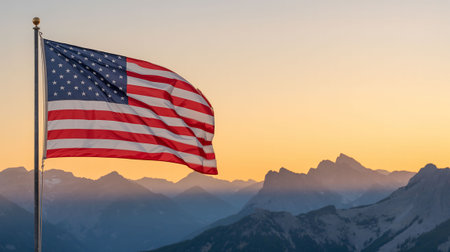Flag of the United States waving in the wind against the background of the mountainsの写真素材