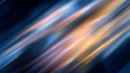 A dynamic abstract image featuring streaks of light in shades of blue, orange, and yellow against a dark background, conveying a sense of movement and energy.の写真素材
