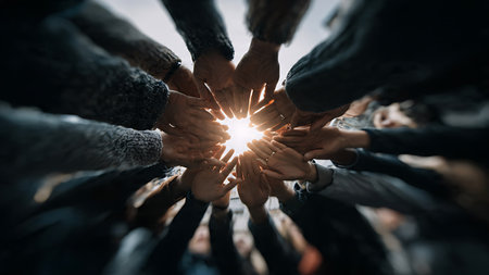 Teamwork concept. Close-up of a group of people joining their hands together.の写真素材