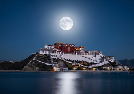 The Potala Palace in Tibet stands majestically under a full moon at nightの写真素材