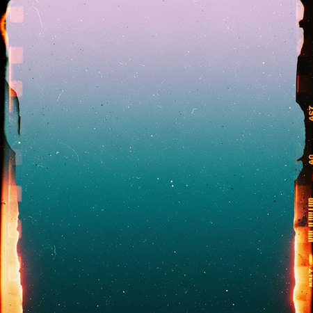 A vibrant gradient background with a film strip texture and a mix of purple, pink, and teal colorsの写真素材