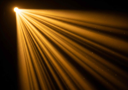 A bright beam of light shining through darkness with vibrant rays and dramatic illumination effectsの写真素材
