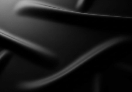 A close-up view of a sleek, modern, black, curved surface with smooth lines and subtle shadowsの写真素材