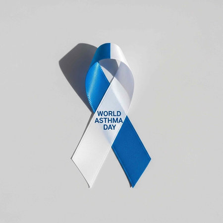 A blue and white ribbon symbolizing World Asthma Day awareness and support for respiratory healthの写真素材