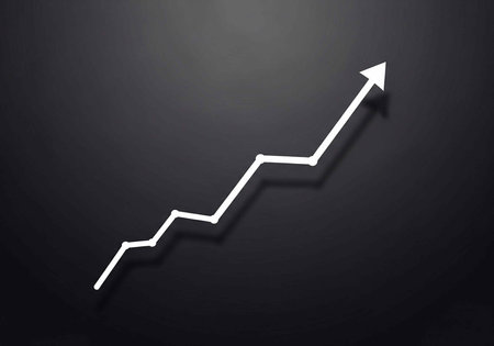 A white arrow graph trending upwards on a dark background, symbolizing growth and progress.の写真素材