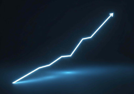 A glowing blue arrow graph shows a steady upward trend in growth and progress on a dark backgroundの写真素材