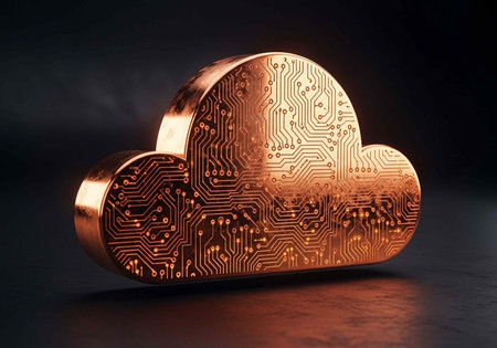 A copper-colored cloud-shaped object with circuit board patterns on a dark surface and backgroundの写真素材