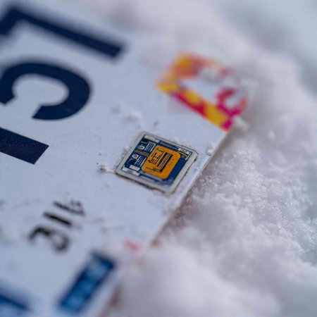 Close-up of a credit card in the snow. Selective focus.
