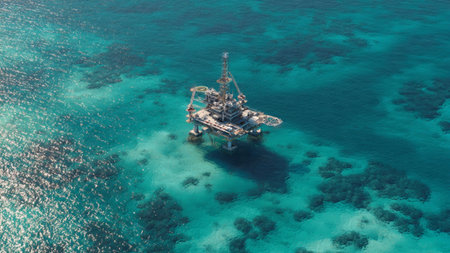 Aerial view of offshore oil and gas platform in the sea.