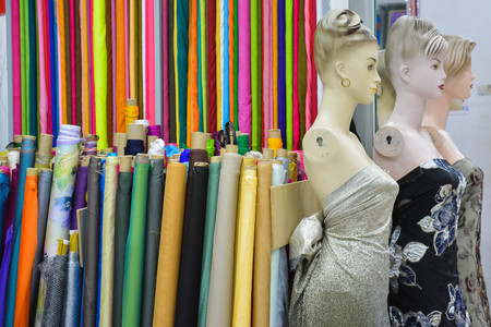 colors fabric textile rolls and mannequinsの写真素材