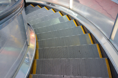 point of view escalator in a mallの写真素材