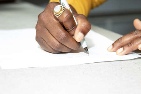 African American woman sketching a schematicの写真素材
