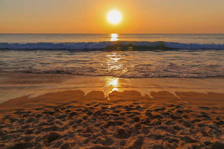 sunset reflected on waterの写真素材