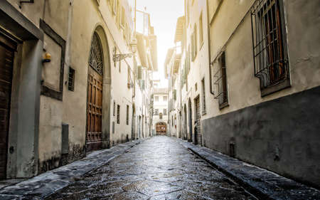 Small old street in Florence (Firenze) after the rainの写真素材