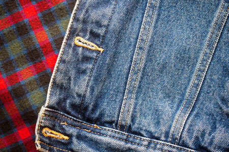 Photo of a pattern of checkered Scottish fabric with jeans for creating a background, pattern, textiles, printed matterの写真素材