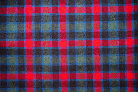 Photo of a pattern of checkered Scottish fabric for creating a background, pattern, textiles,...