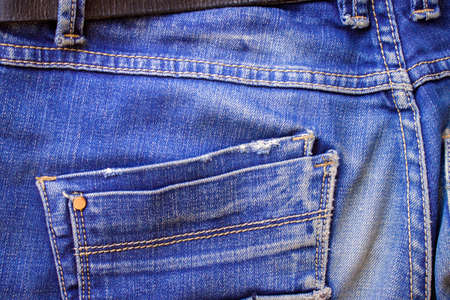 Pocket on male or female blue jeanse texile trousers behind indigo colorの写真素材