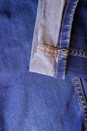 Blue men's or women's jeanse texile trousers indigo color with a pivoted legの写真素材