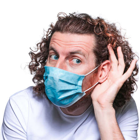 Man in medical mask. In fear of coronavirus 2019-ncov covid-19 concept.の写真素材