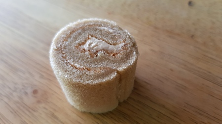 cake roll and coffee on wooden tableの写真素材