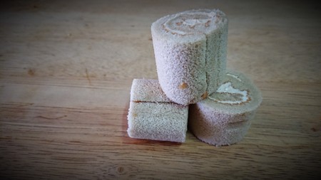 cake roll and coffee on wooden tableの写真素材