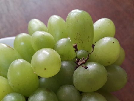 bunch green grapes on woodenの写真素材