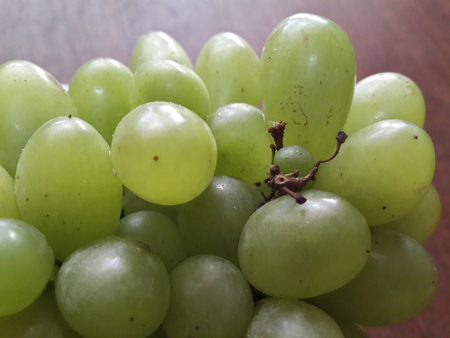 bunch green grapes on woodenの写真素材