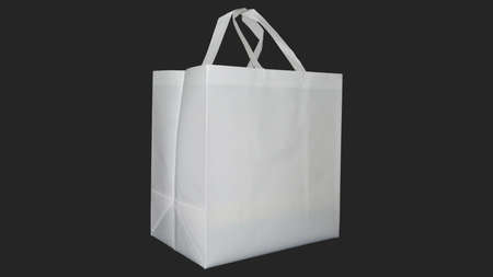Beautiful Non Woven grocery shopping ECO bag with black background. Copy space for text and logoの写真素材