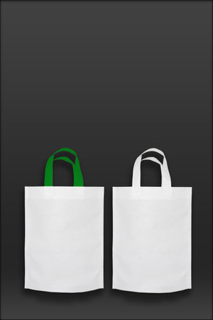 Beautiful White Non Woven grocery shopping bag with black background. ECO Friendly Bag isolated on black background. copy space for text. Use meの写真素材