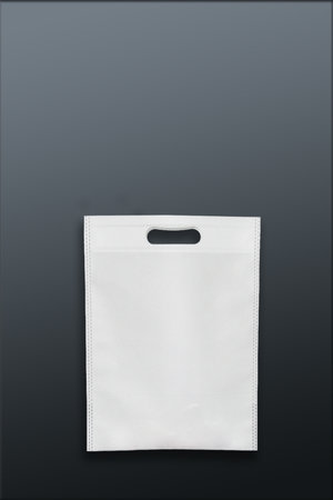 Beautiful White Non Woven grocery shopping bag with black background. ECO Friendly Bag isolated on black background. copy space for text. Use meの写真素材
