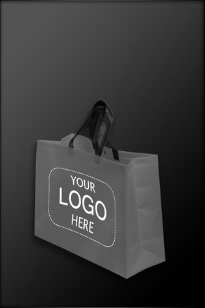 Beautiful black Non Woven grocery shopping bag with black backgroundの写真素材