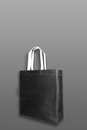 Beautiful black Non Woven grocery shopping bag with black backgroundの写真素材