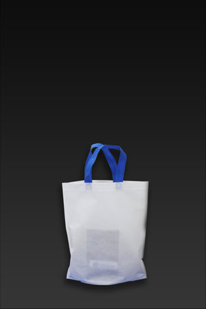 Beautiful White Non Woven grocery shopping bag with black background. ECO Friendly Bag isolated on black background. copy space for text. Use meの写真素材