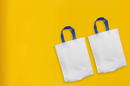 Beautiful Non Woven Grocery Shopping Bag with yellow background. Tote ECO Bags
