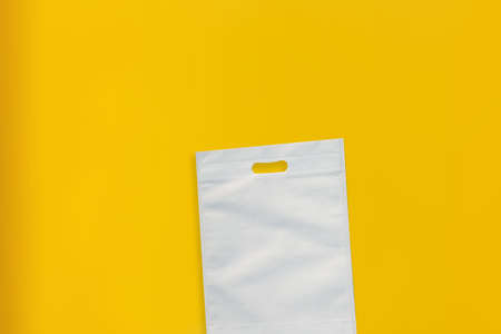 Beautiful Non Woven Grocery Shopping Bag with yellow background. Tote ECO Bagsの写真素材