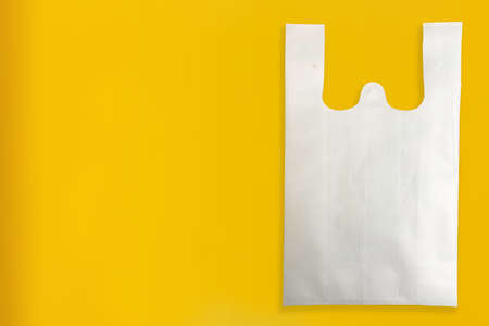 Beautiful Non Woven Grocery Shopping Bag with yellow background. Tote ECO Bagsの写真素材