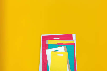 Beautiful Non Woven Grocery Shopping Bag with yellow background. Tote ECO Bagsの写真素材