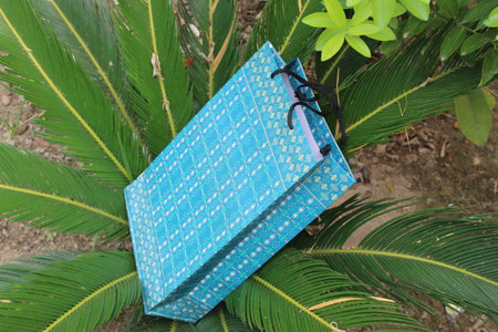 Colorful Paper Shopping bags are isolated on a green natural background. no plastic bags only eco-friendly bags.の写真素材