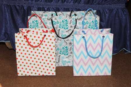 few different paper shopping bags. Set of Colorful Empty Bags for Mockup. Composition of space for branding. close up view bagsの写真素材