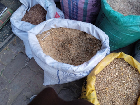 Nutritious Cattle Feed Stored in Colorful Sacks, Essential for Dairy Farming and Livestock Health, Supporting Sustainable Milk Production and Agricultural Developmentの写真素材